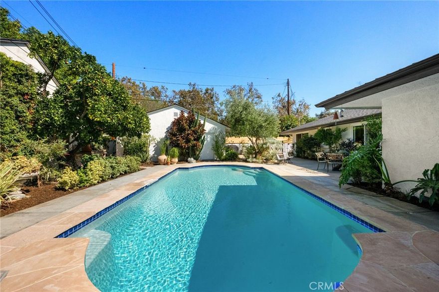 Originally custom-built in 1962 by local builder Art Herrick for Roy & Mildred Bruns. This stunning home is a true gem of West Floral Park—beautifully honoring it’s mid-century modern origins while showcasing a top-to-bottom remodel that brings it stylishly into the present day. 

Step inside and experience a home that perfectly balances vintage charm with modern luxury. The heart of the home is the gorgeous, remodeled kitchen—designed with both form and function in mind. Featuring all-new appliances including a sleek 6-burner 36” gas Forno range, quartz countertops, loads of crisp white cabinetry with beveled glass accents and soft-close drawers & doors. A spacious island with seating for 4 and even a cozy in-kitchen dining nook overlooking the lush backyard—this is a space made for both entertaining and everyday living.

Bright and airy, the living room is filled with natural light from large windows and centers around a beautiful, arched fireplace with mid-century style and a raised tile hearth. The dining room carries on the retro flair with a chic mid-century modern light fixture and glass sliding doors that lead straight to your backyard oasis.

Each of the three oversized bedrooms is a retreat in itself—featuring generous windows, updated lighting, and new closet doors. The primary suite is especially impressive with its walk-in closet, private access to the pool, and spa-like en suite bath featuring a massive walk-in shower with bench and multiple shower heads, dual sinks, and elegant quartz finishes.

Throughout the home, you’ll notice thoughtful, timeless touches—like the custom glass-inset front door, classic moldings, and smooth flow between indoor and outdoor living. Upgrades abound: new roof, double-pane windows and sliders, new flooring, new HVAC, recessed lighting, and a bright, functional laundry area. 

Outside, enjoy California living at its best! A private living wall surrounds a sparkling pool, stone patio, center piece Olive tree and a fruit-bearing orange tree create the perfect backdrop for relaxing weekends or lively gatherings.

Nestled in the heart of the friendly and historic West Floral Park neighborhood, this is more than just a place to live—it’s a place to be part of something special. Known for a strong sense of community and fun events like Open Garden Day and an epic 4th of July parade, West Floral Park invites you to slow down and soak in the beauty around you while you get to know your neighbors.