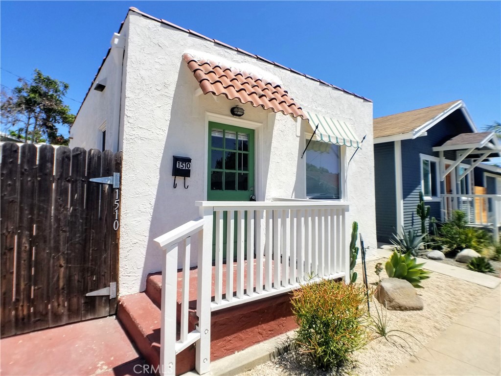 This lovely home is located on a small street in a wonderful Long Beach neighborhood, centrally located near parks, schools, and transit. The home includes newer laminate flooring in the living room with several windows and a built-in bookcase and faux fireplace, blinds, and connects to a nicely sized kitchen that has been recently remodeled to include white shaker cabinets and quartz countertops. There is a spacious bedroom with french doors that open to a private rear yard and shared garage. Enjoy the convenience of water included.