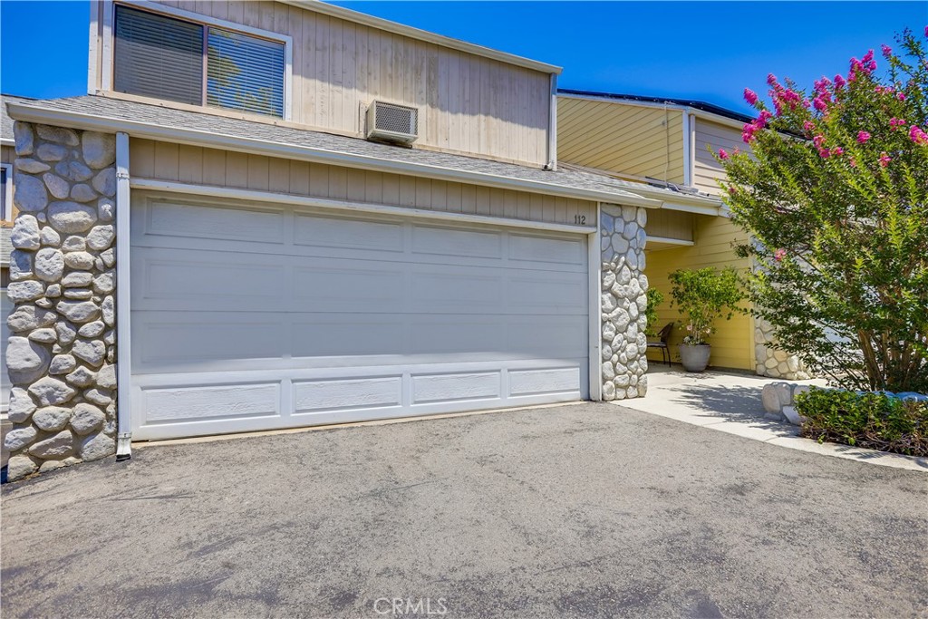 Superbly located Studio Unit in prestigious guard gated Coto De Caza in The Village nestled amongst rolling hills within walking distance of exclusive Coto De Caza amenities including Coto Valley Country Club, Coto Equestrian Preserve, Golf Courses, local parks, and numerous hiking and biking trails. The sunny front courtyard entrance creates a welcoming first impression. Step inside the main level entrance and travel up the stairs to unit B, step inside and soak in the soaring vaulted open beam ceilings, tile floors, and the open concept floor plan. The main living area boasts a cozy fireplace and sliders opening to the wrap around private patio creating an ideal space for indoor-outdoor living. The living area is open to the kitchen providing a flexible living space. The kitchen boasts Quartz topped white shaker cabinetry and sliding doors opening to a private balcony perfect for morning coffee and relaxing in the amazing OC weather. The full bathroom has updated Quartz topped white shaker vanity, linen cupboards, and clothes closet. This unit includes access to the shared washer & Dryer in the attached garage and 1 assigned uncovered parking space nearby. Just steps from the community pool, Coto Pickleball Club, and Live Oak Park with tranquil and serene walking paths, you can’t beat this location. Landlord pays all utilities!