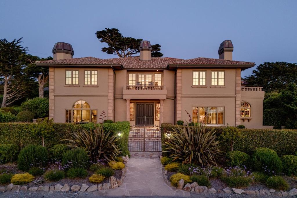 One of Pebble Beachs most desirable areas, this stunning Country Club West estate home has whitewater ocean, sunset & MPCC Shore Course views. Much larger than todays standards the home offers gracious living & dining rooms ideal for family gatherings & entertaining. Kitchen features Viking appliances & adjacent pantry with wine fridge, bar fridge, sink, microwave, glass-front cabinetry & abundant storage & counter space. Family room features vaulted exposed beam ceiling, cozy fireplace & two pair of French doors to private backyard patio with outdoor kitchen & large firepit. Expansive primary suite with fireplace, ocean-view balcony office/sitting area plus a bedroom with ocean views & another fireplace also includes huge walk-in closet & dual bathrooms. Three more suites each have a fireplace. Large landscaped corner lot just a short stroll to MPCC Shore Shelter & coastal walking paths. Current 5-car garage could converted into a 5th bedroom while still maintaining a 3-car garage. Radiant heating throughout, dual laundry areas & generator.