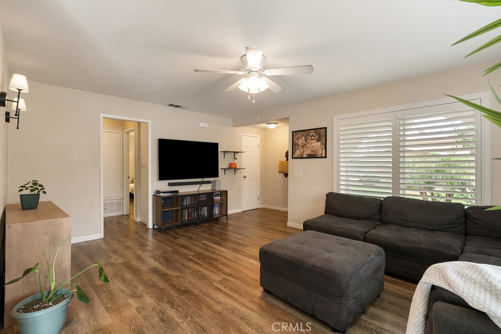 Welcome to 1313 Via Santiago, Unit A, Corona, CA 92882, a beautifully upgraded 2-bedroom, 1-bathroom condominium located in the highly sought-after Village Grove Four Plex community. Offering 902 square feet of thoughtfully designed living space, this home combines modern updates with the peaceful charm of Corona’s Village Grove neighborhood. Step inside to find plantation shutters, durable vinyl plank flooring, and a remodeled kitchen featuring new cabinetry, granite countertops, and updated fixtures. The open-layout design creates a warm, inviting flow throughout the home. With ceiling fans, an in-unit washer and dryer, and ample natural light, every detail is designed for comfort and convenience. Step outside to your private back patio, newly upgraded with pavers and brand-new fencing, perfect for morning coffee, outdoor dining, or entertaining friends.Residents of Village Grove Corona enjoy a variety of resort-style amenities, including a sparkling swimming pool, scenic private lake with paddle boats and catch-and-release fishing, and sports courts for tennis, basketball, and volleyball. Tree-lined streets, BBQ areas, and walking paths create a welcoming and active community atmosphere. Ideally situated in West Corona, this home offers convenient access to 91 and 15 freeways, top-rated Corona-Norco schools, and popular destinations like Corona Heritage Park & Museum, Fender Museum of Music, Eagle Glen Golf Club, and The Shops at Dos Lagos. Enjoy a balance of suburban tranquility and easy access to Riverside, Orange County, and the Inland Empire’s major job hubs. Don’t miss your chance to own this move-in-ready gem in Corona’s vibrant Village Grove community where modern upgrades meet Southern California living at its best.