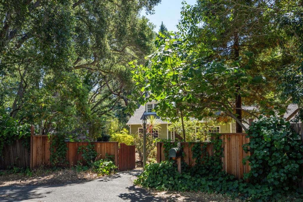 Located on a quiet, tree-lined cul-de-sac in the heart of prestigious Atherton, 2 Bassett Lane is a rare and exceptional offering. This expansive property, set on a flat 27,984 square foot lot, is surrounded by mature trees that provide a peaceful, private atmosphere rarely found in todays market. Owned and lovingly maintained by the same family for over 50 years, the home exudes warmth while presenting boundless opportunities for the future. Whether you envision remodeling the current residence, designing a custom estate, or exploring potential subdivision (buyer to verify with the town of Atherton), this property delivers the space, setting, and location to make your vision a reality.