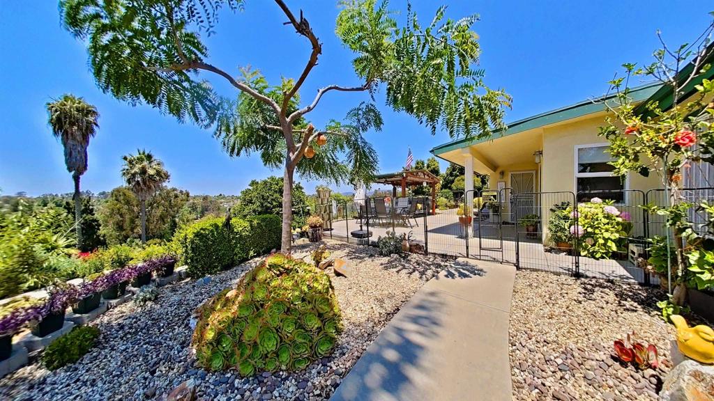 This beautifully upgraded, people and dog-friendly home features 3 bedrooms, 3.5 baths and offers 1,951 sq ft of single-level living on a lush & lovely, half-acre+ hilltop lot. This semi-rural setting is bustling with wildlife including butterflies, hummingbirds and the occasional great horned owls! Enjoy spectacular sunsets from this entertainer’s dream, front-yard featuring a large, gazebo-covered patio, BBQ & smoker, multiple outdoor dining spaces, about two dozen fruit trees and about 1000 sq ft of raised garden beds (landscaping maintenance provided). Watch the sunset with your closest friends as you enjoy a home-grown meal! Inside, the 2016 renovation shines with engineered oak hardwood and porcelain tile floors, sound-dampening plaster walls, whole-house water filtration, and a chef’s kitchen with granite counters, pot-filler, high-end appliances, and abundant storage. The spacious primary suite boasts a soaking tub, walk-in shower, and walk-in closet (Decorative Only Fireplace). One of the guest rooms includes its own bathroom; providing comfort and privacy for extended-stay guests. Extras include solar panels, central A/C, direct entry 2-car garage, laundry room & service area with an additional bathroom, large storage closet, and a landscaper for general yard maintenance. One of the bathrooms even features a Japanese Toto bidet! Dog-friendly. peaceful, private, and ready for move-in October 1st, 2025! No smoking. No cats, fish tanks. Tenant pays trash and all utilities, Landlord pays for grounds maintenance. Deposit equal to one month's rent and $5k security deposit. 640 minimum credit score and 2x rent in monthly income. Credit checks required for all tenants 18yrs and over and paid by prospective tenant. Application link https://apply.link/yRDmgLE