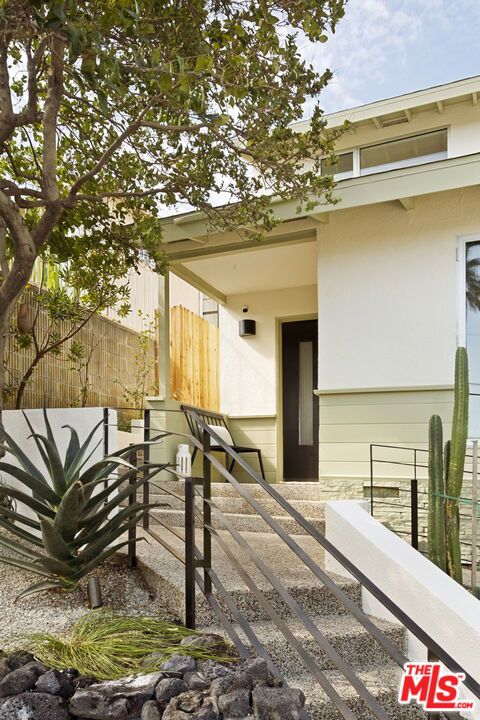 This 3 bed/1.5 bath Mid-Century charmer in a prime Franklin Hills location offers a sublime SoCal indoor/outdoor way of living. Here the interior space feels amplified by the inviting accessibility of the outdoor spaces--which include a gorgeously restored kidney-shaped pool surrounded by a broad flagstone patio with ample room for sunning, lounging and sharing meals with friends. Open format living, dining and kitchen spaces convey a relaxed feel and inspired connectivity--because a lovely vista is always at hand, day-to-night, through picture windows and breezy passageways. Period floating brick FP, oak floors, wood TnG breakfast ceiling and openwork metal railings are some of the distinctive 1st fl. details. Step-down addition (bed or office/fam rm) has freshly poured cement floors & Fleetwood sliding doors which open to a private redwood patio, perfect for enjoying your morning brew. Upstairs are 2 beds/1 bath inc. the primary w/ stunning panoramic views from the Observatory to the ocean. Substantial list of recent Seller upgrades make this a turn-key purchase ready to make your LA dreams come true--just in time for Fall's warm days and cooler evenings.