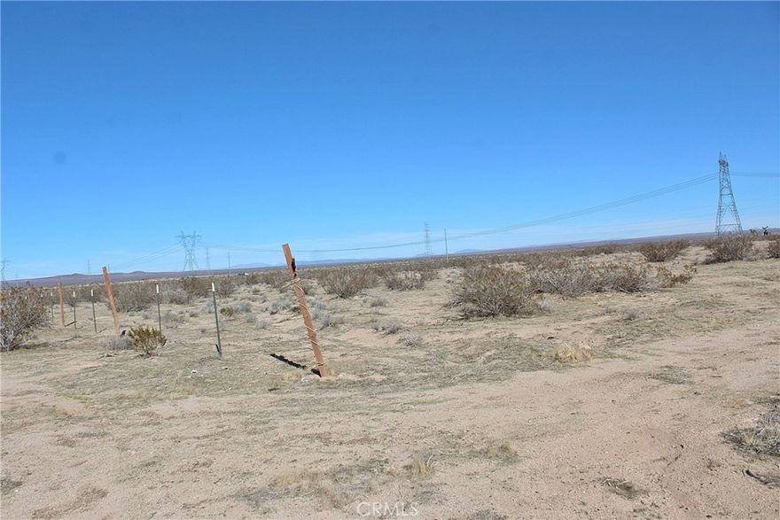 Looking to invest in land with strong growth potential? driving north on Highway 395 just 4.2 mile north of Shadow Mountain Rd and 0.2 mile to the left  or same directions just 0.7 mile north of Buckthorne Canyon Rd you will find this 2 and a half acre of flat land, with only about 0.2 mile close proximity to the Highway 395 and there is a fence approximately in the west property line, this parcel offers a fantastic opportunity in fast developing area of the High Desert.  This may be a good investment to keep your money safe, while maintaining a piece real estate in your portfolio.   The High Desert is now the future home of the recently approved High Speed Train from Apple Valley to Las Vegas and to the south to Rancho Cucamonga. The project is expected to break ground in the Victor Valley soon and be completed in over the course of the next few years, this projected is expected to bring in jobs and boost the economy of the High Desert.