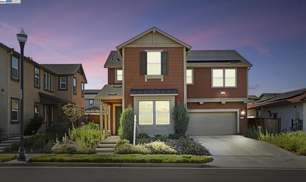Welcome to this GORGEOUS EAST FACING, 4 BEDROOM, 3 BATHROOM, 2 CAR GARAGE, OWNED SOLAR, BUILT IN 2021, 2,563 sq ft of living space sitting on a massive 5,734 sq ft lot in the highly sought after TRACY HILLS. Upgrades include WOODEN VINYL FLOORS, PREMIUM CARPETS,& EPOXY FLOORING and STORAGE RACKS in the garage. It’s designed for comfortable living as the 1st floor comes with a bedroom and full bathroom. The great room combines the living room, kitchen and dining area creating an open and inviting area with plenty of natural light. The MODERN KITCHEN boasts QUARTZ COUNTERTOPS, SLEEK STAINLESS STEEL APPLIANCES, A LARGE ISLAND, CUSTOM BACKSPLASH, & WALK-IN PANTRY. The primary suite is a true sanctuary with a luxurious en suite bath featuring a LARGE SOAKING TUB, SEPARATE SHOWER, HIS AND HER SINK, AND A GENEROUS WALK-IN CLOSET. Enjoy the LARGE BACKYARD with FULLY GROWN FRUIT TREES and lots of green space to play & party with family & friends. Enjoy unparalleled PRIVACY as there is lots of open space in the NORTH/EAST CORNER & front of the home. It’s walking distance to TOP RATED CORRAL HOLLOW ELEMENTARY SCHOOL. Amenities include a CLUBHOUSE, & SWIMMING POOL perfect for summer. You’ll have EASY ACCESS TO I-580 & ACE train station. Don't miss the chance to make this your dream home!!!