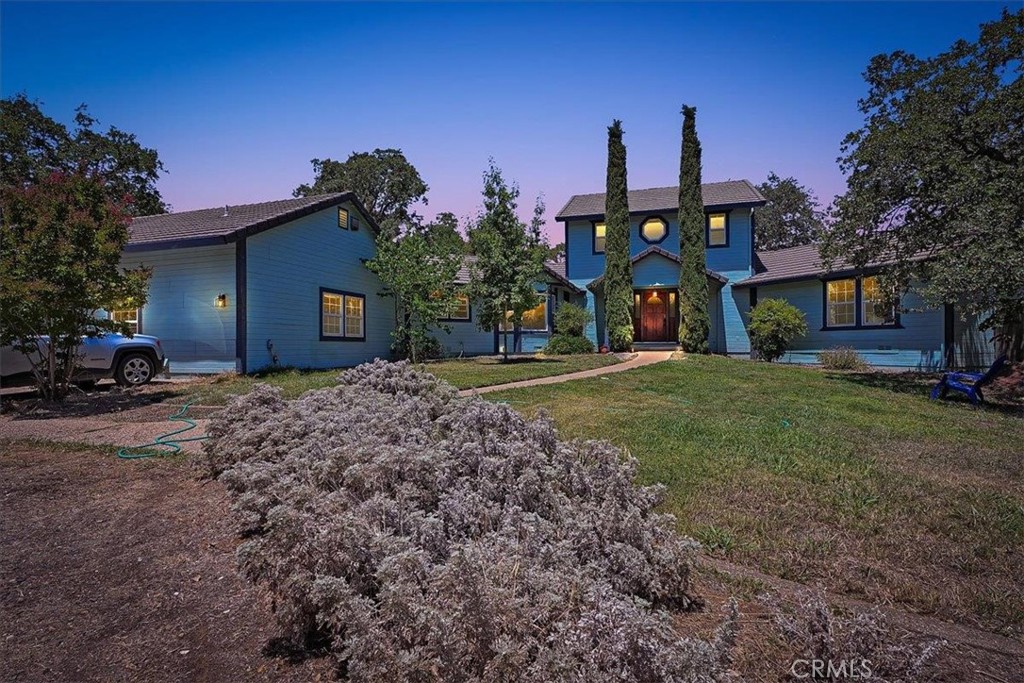 Discover the perfect blend of space, comfort, and countryside charm with this custom-built 2,800 sq. ft. home on nearly 6 usable, fenced acres, ideal for horses, farm animals, or simply room to roam. This 3-bedroom, 3-bath home offers a flexible layout with a bonus entertainment suite, sunroom bar, den, and game/party room (or optional 4th bedroom). Enjoy a bright white kitchen with a garden window, breakfast nook, and ample cabinetry, plus a spacious laundry room and full bath nearby. The main-level primary suite boasts vaulted ceilings, private deck access, an office, and a luxurious en-suite with soaking tub, dual vanities, and tiled shower. Relax in the inviting living/dining area with wood-burning fireplace and views from two sliders. Upstairs features two bedrooms with private deck access and full hall bath. Outside, a custom gunite pool/spa with rock waterfall awaits your TLC to restore its full beauty. New carpet throughout, private location, and easy access to local favorites like Collins Lake, Pizza Round-Up, and just minutes to Marysville, Yuba City, and Beale AFB. A truly unique opportunity!