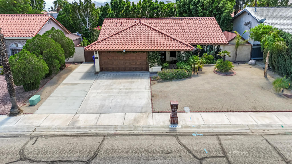For Lease - Available October 8th.Welcome to this charming and upgraded 2-bedroom, 2-bath home located on a quiet street in the desirable Panorama subdivision of Cathedral City, just a few doors from the popular Panorama Park.From the moment you arrive, you'll be greeted by vine-covered walls, desert landscaping, and inviting curb appeal. Inside, soaring cathedral ceilings create an airy feel in every room, complemented by updated flooring throughout for low-maintenance living.The well-equipped kitchen opens seamlessly to the dining and living areas, complete with a cozy fireplace and French doors leading to the lush backyard. Outside, enjoy a spacious covered patio, a gas fire pit, and a sprawling lawn, perfect for entertaining.A unique bonus feature is the fully finished shed with A/C, ideal for a private office, gym, or creative studio. The attached 2-car garage includes laundry and a Level 2 electric car outlet, plus the driveway has space for two additional cars and even a small RV.Additional highlights include:Owned solar system (owner covers solar and landscaping costs).Flexible furnishing options (currently listed unfurnished but can be leased furnished at an adjusted rate).Convenient location close to parks, shopping, dining, and easy freeway access.Ready for you to move in and enjoy desert living.