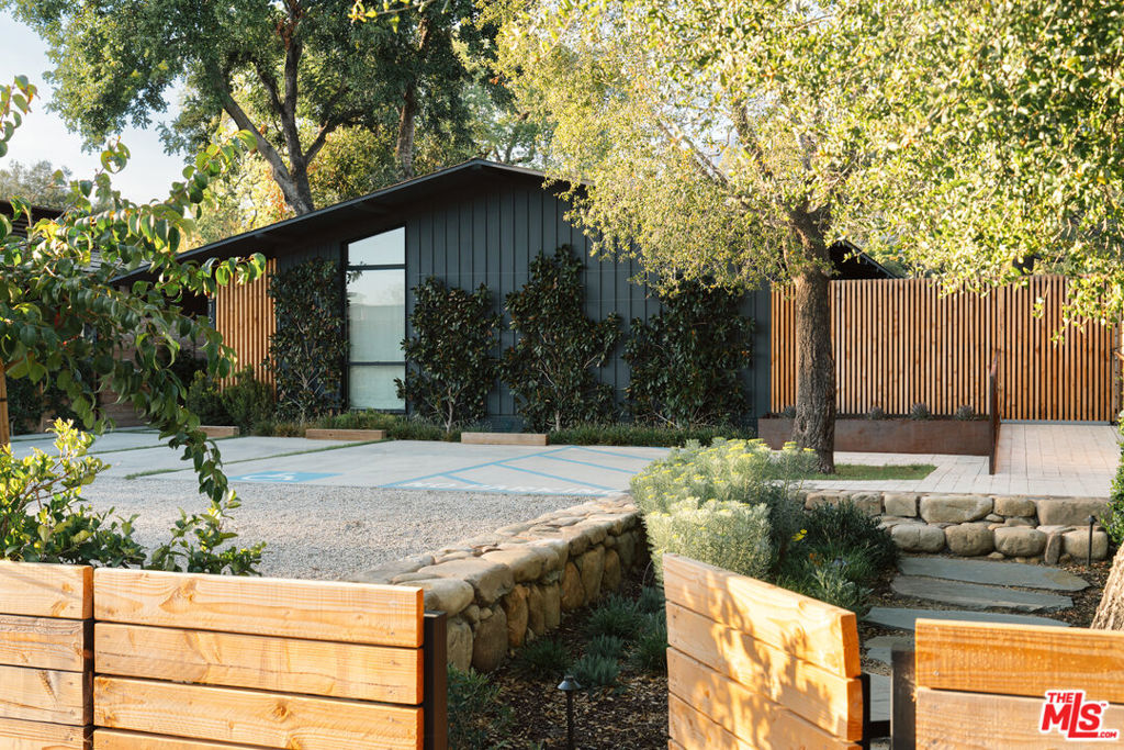 Discover this turnkey, reimagined mid-century modern masterpiece located in the heart of Ojai. Zoned village-mixed-use, this unique live/work property offers an ideal location next to the lively Ojai Certified Farmers Market, top-rated restaurants, wineries, boutiques, galleries, the Ojai Valley Inn & Spa, and around the corner from the new Hotel El Roblar. Designed by the renowned Whelan-O'Neill architectural firm and completed in 2023, this thoughtfully renovated space features 750 sqft+/- of retail/commercial space and 1,205 sqft+/- of private living. Hardscaping and landscaping have been extensively upgraded throughout. Additional upgrades include an outdoor shower; whole-house water filtration provided by Life Source; Waterworks plumbing fixtures; Apparatus, Noguchi, and vintage lighting fixtures; Nanz decorative hardware; electrically operated skylight shades; new primary bath cabinetry; new electrical floor sockets, and updated wiring to provide the home with the highest-speed internet. The private living quarters boast two stylish bedrooms, two-and-a-half spa-inspired bathrooms with radiant heated tile floors, and an open-concept living area, including a modern chef's kitchen. The expansive backyard, a rare find in downtown Ojai, is perfect for entertaining, offers room for a pool or ADU, and provides stunning views of the iconic Topa Topa mountains, especially during the famous Ojai Pink Moment. This property is an ideal live/work sanctuary in vibrant, historic Midtown Ojai.