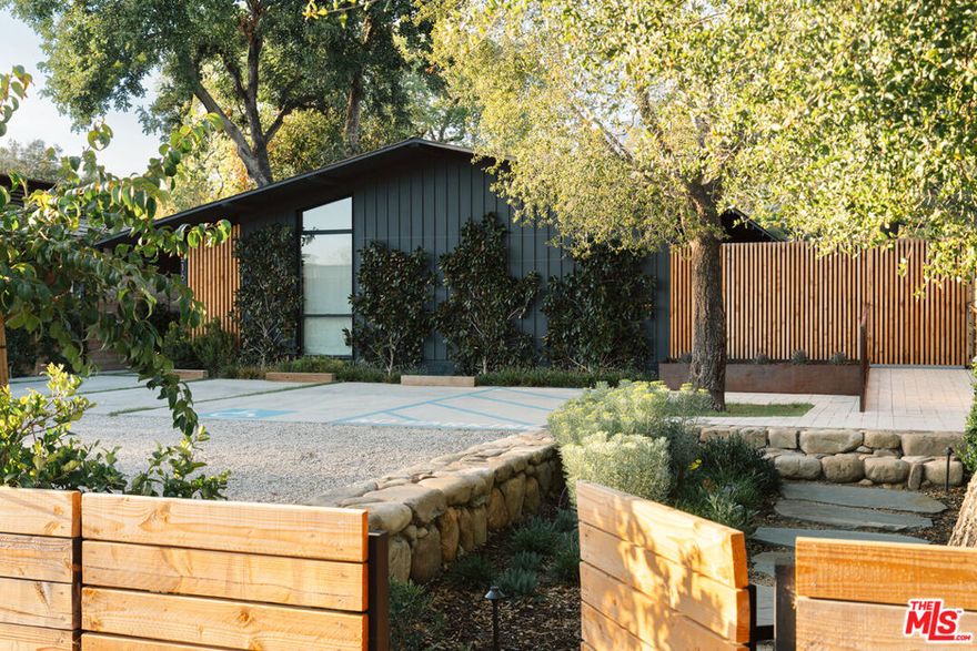 Discover this turnkey, reimagined mid-century modern masterpiece located in the heart of Ojai. Zoned village-mixed-use, this unique live/work property offers an ideal location next to the lively Ojai Certified Farmers Market, top-rated restaurants, wineries, boutiques, galleries, the Ojai Valley Inn & Spa, and around the corner from the new Hotel El Roblar. Designed by the renowned Whelan-O'Neill architectural firm and completed in 2023, this thoughtfully renovated space features 750 sqft+/- of retail/commercial space and 1,205 sqft+/- of private living. Hardscaping and landscaping have been extensively upgraded throughout. Additional upgrades include an outdoor shower; whole-house water filtration provided by Life Source; Waterworks plumbing fixtures; Apparatus, Noguchi, and vintage lighting fixtures; Nanz decorative hardware; electrically operated skylight shades; new primary bath cabinetry; new electrical floor sockets, and updated wiring to provide the home with the highest-speed internet. The private living quarters boast two stylish bedrooms, two-and-a-half spa-inspired bathrooms with radiant heated tile floors, and an open-concept living area, including a modern chef's kitchen. The expansive backyard, a rare find in downtown Ojai, is perfect for entertaining, offers room for a pool or ADU, and provides stunning views of the iconic Topa Topa mountains, especially during the famous Ojai Pink Moment. This property is an ideal live/work sanctuary in vibrant, historic Midtown Ojai.