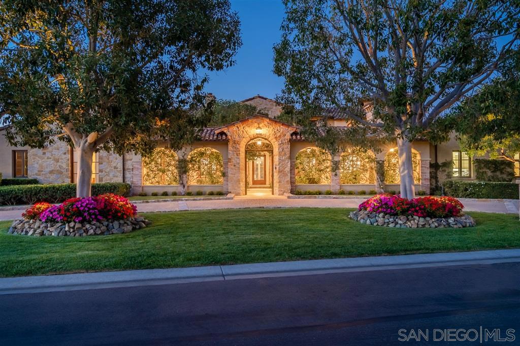 Dedicated to a life style rich in amenities and the essence of Modern European flair. Located within the gated community of The Bridges at Rancho Santa Fe, one of the most prestigious and sought after communities in Rancho Santa Fe and Southern California. The Architectural design creates the ultimate destination for today’s stay at home environment. Multiple spaces for offices, private bedroom suites, two family rooms, Epicurean kitchen, pool house, and separate guest suite off the center courtyard. Private parking with a 6 car tuck under parking garage with its own elevator plus an attached two car garage off the main entrance. This creation of luxury was meticulously constructed by master builder, Steve Sharratt. Situated on a short cul de sac with spectacular views of the Bridges Private Club House, the signature 10th fairway and green, 11th green and two night lit ribbon stress bridges. As you enter the private front courtyard gates, you are greeted with a lush garden and sitting area. The main living level includes a sumptuous owners suite, with luxurious bath and his and her dressing rooms which open to a private veranda with an outdoor spa and spectacular views of the pool, fairways and private open space. Private Office / library that opens into the center courtyard. The living room, family room, and informal dining area all focus on the views and outside entertaining areas. The lower level, accessed by either an elevator or stairway, is a paradise for all of your recreational desires; 14 seat state of the art theatre, professional full-swing golf simulator, game / arcade room along with a full service bar with chilled and temperature controlled wine room. The upper floor consists of three en-suite bedrooms and family room along with a generous size viewing deck. Custom design features include Albertini windows, hand chiseled stone interior and exterior walls, vintage timbers, rich walnut flooring, antique terra-cotta pavers, honed and tumbled ston...