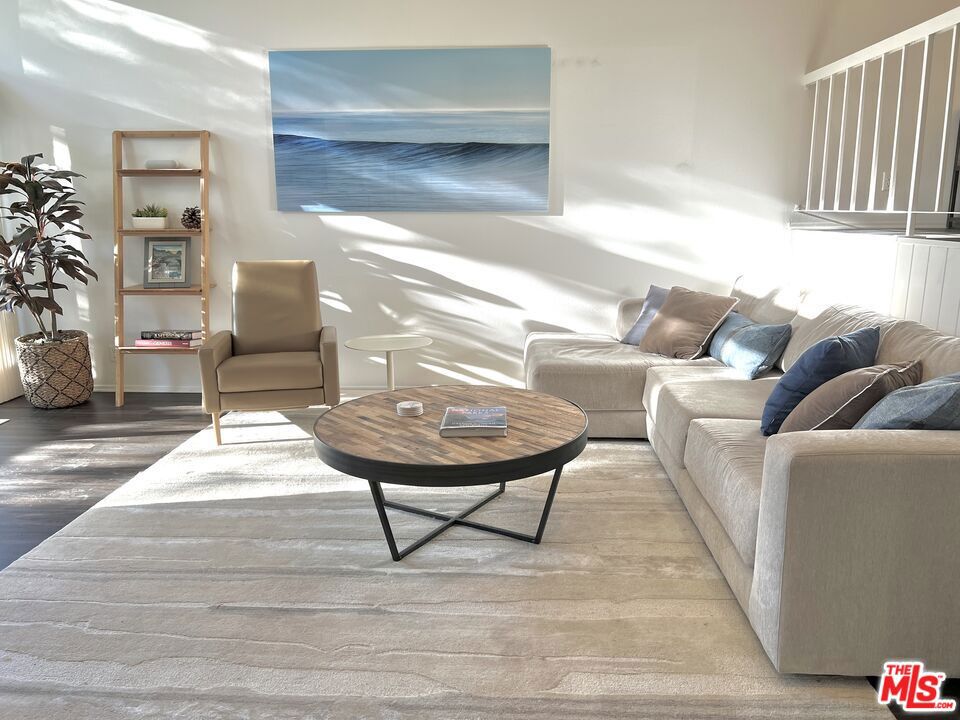 FURNISHED and updated, this Palisades townhome offers mountain views and a peaceful location with access to the community pool and spa and just minutes to the beach, grocery, hiking and restaurants. The bright living room has vaulted ceilings and is open to a patio with mountain views. The dining room, powder room, kitchen and great room with built-ins complete the main living areas. Upstairs the large primary suite has a private balcony with more views & a primary bath with shower and a large walk-in closet; down the hall is a second ensuite bedroom as well as upstairs laundry. Newer wide plank flooring and carpeting throughout, seamless shower door in master suite, recessed LED lighting, direct access 2 car garage. Community pool, spa and gym are nearby and a great addition!