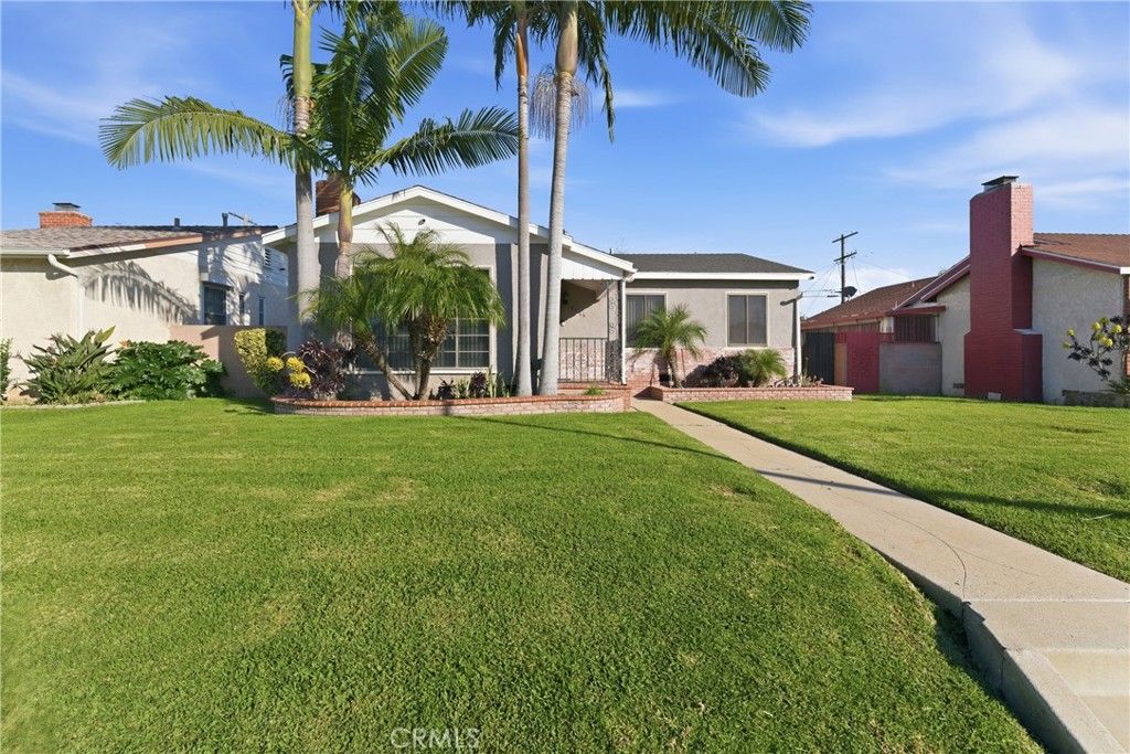 Photo of 9716 S Van Ness Ave, Los Angeles, CA 90047 (MLS # DW26013802)