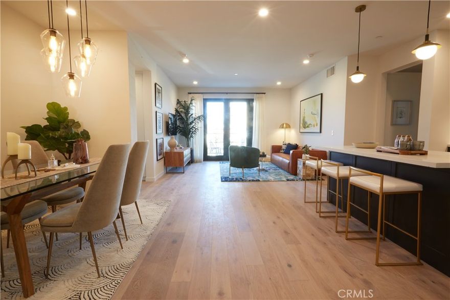 The Estelle, the Fairfax District's premiere condominium community.  Featuring 61 distinctive new residences designed to elevate your lifestyle.  Residence #311 is a beautiful, 2-bedroom, 2-bathroom home.  The residence features generous indoor-outdoor living space and a tranquil location.  Meticulously crafted with wide-plank European oak flooring, quartz countertops, soft-close Italian Kitchen Design cabinetry, a generous kitchen island, under cabinet wine refrigerator and built-in espresso system, a Bosch appliance suite, smart home features, custom closets, and recessed lighting.  The home is centered around an open-concept kitchen, dining, and living area.  Residents will enjoy convenient access to all of The Estelle's resort-style amenities, including pool and spa retreat, 3 rooftop terraces with fire pits and BBQ areas, an entertainment lounge with chef's kitchen, bar and terrace dining, fitness studio opening to a yoga / meditation courtyard, private dining and conference space, pet spa, bike room and EV Charging opportunities.  The photos showcased are of our beautiful model homes.  Explore, enjoy, entertain at The Estelle.