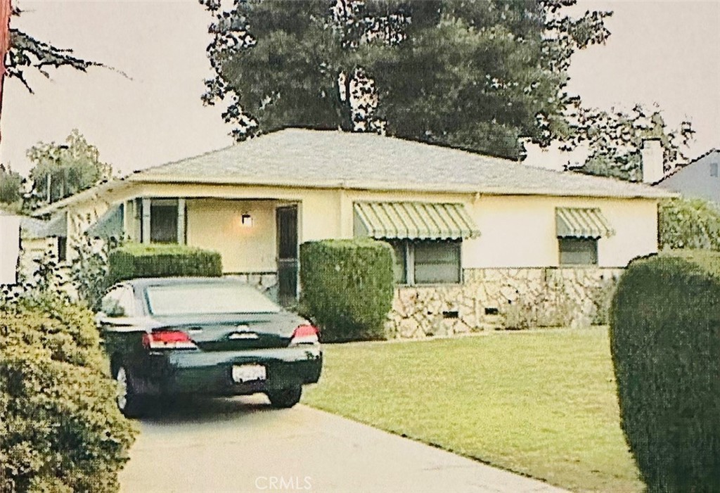 This 2-bedroom, 1-bath home sits on a lot that spans over 8000 sf! Features include oak hardwood flooring and original kitchen. Family room was added in 1987 with access to the expansive backyard, perfect for entertaining or relaxing. The detached garage is equipped with fully functional 3/4 bath, closet and built-in cooling unit. Built out laundry room is behind garage. Buyer to verify all information and permitting with the city. Property will be sold AS IS with no repairs or credits. This is a Probate sale. No court confirmation required.