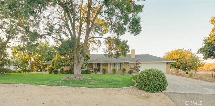 Discover Cardiff Lane in McSwain, offering a quaint ranch ambiance! This property hits the market for the first time and has been with the same family since its construction. The detached WORKSHOP spans 23ft by 31.5ft, about 713+/-sf, with an overhang at the rear for additional storage. Inside the workshop, you'll find a roll-up door, finished walls with texture, and several windows. Ideal for car enthusiasts or conversion into an Accessory Dwelling Unit (ADU) with its own driveway. The corner lot boasts mature trees providing shade, fruit-bearing trees, enclosed pasture space, a fenced-in dog kennel, and a covered patio perfect for summer barbecues. Inside, there's a warm family room with a brick fireplace and with built in speakers for surround sound, four bedrooms, two bathrooms, an indoor laundry, laminate floors, and a whole-house fan to boost efficiency. The country-style kitchen features tiled countertops, elegant tiled floors, a breakfast bar, ample cabinetry, a stainless microwave/hood, and a stainless-steel electric range. Act fast, as this gem is sure to go quickly!
