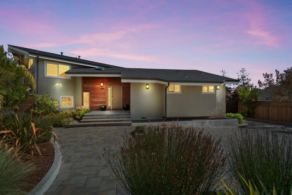 Perched at the top of a peaceful cul-de-sac, this spacious 5-bedroom, 2.5-bath home offers 3,492 sq ft of thoughtfully designed living area with sweeping views of the bay. Inside, the beautifully updated kitchen with huge island pairs modern finishes with everyday comfort. The open-concept upstairs living room is perfect for gathering and taking in the scenery, while the split-level primary suite provides privacy and retreat. Downstairs, you'll find a generous family room and additional bedrooms, ideal for guests, kids, or a home office. The expansive lot offers room to play, garden, and fully embrace outdoor living. With its exceptional separation of space, this home balances togetherness and personal retreat. Just minutes from the beach, restaurants, shops, and award winning schools, its the perfect blend of convenience, comfort, and coastal lifestyle.