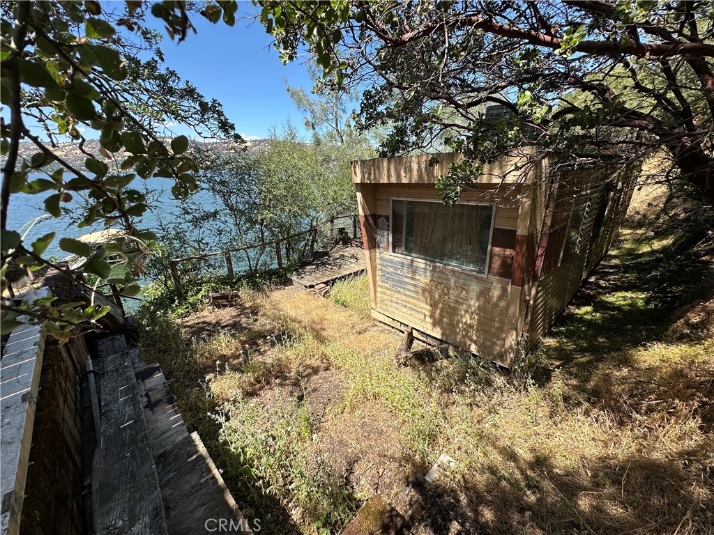 Lakefront Lot! Enjoy building your dream home on the waters edge. Block garage is usable. Older mobile is still on property. Some utilities may be on property. Buyer to investigate all utilities. Is access from North DR.