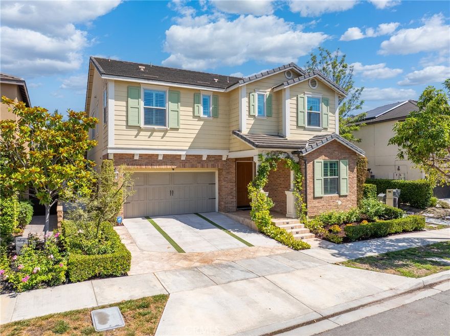 Welcome to the stunning, turn-key home in the coveted community of Greenwood in Tustin Legacy! This immaculate 5-bedroom, 4.5-bathroom residence offers the perfect blend of luxury, comfort, and convenience. This beautifully upgraded home features an expansive open-concept floor plan ideal for modern living and entertaining. The gourmet kitchen is a chef’s dream, complete with a large center island, breakfast bar, and an elegant dining area. The spacious family room seamlessly opens to the backyard through multi-panel panoramic doors, creating a perfect indoor-outdoor lifestyle. Enjoy the professionally landscaped yard featuring an outdoor kitchen with BBQ, a tranquil fountain, and ample space for gatherings. Inside, you’ll find wide plank hardwood flooring, plantation shutters, crown molding, custom built-ins, and upgraded walk-in closets throughout. The main floor offers a private bedroom with en-suite bath, ideal for guests or a home office. Each bedroom includes its own en-suite for ultimate privacy and convenience. As a resident of Greenwood, you will enjoy access to the exclusive amenities of the Legacy Club, including a resort-style pool and spa, clubhouse, BBQ areas, water features and parks with basketball courts, bocce ball, and playgrounds. Located just minutes from the many amenities of The District at Tustin Legacy, you will have easy access to premier shopping, dining, entertainment, top-rated schools and close access to major freeways and toll roads. Don’t miss your chance to own this exceptional home at 261 Barnes Rd – schedule your private tour today!!