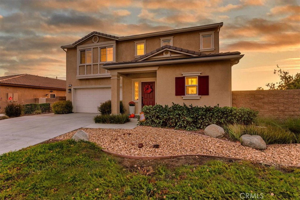 Unobstructed views of the Inland Valley stretch out behind this five-bedroom POOL home, offering a daily backdrop of stunning sunsets and a front-row seat to the Mt. Rubidoux fireworks! The in-ground saltwater pool takes full advantage of the elevated lot, framed by a custom three-tier vinyl patio cover with retractable privacy screens, extensive paver flooring, and a dedicated area for a firepit or outdoor seating. A large side yard adds flexibility for storage, play, or future expansion.
Inside, the floorplan is as functional as it is spacious. A downstairs bedroom with a nearby full bath makes an ideal guest room or in-law space. Upstairs includes four separate bedrooms and a bonus family room. Also located upstairs: an oversized walk-in linen storage closet and a dedicated laundry room, conveniently located near the bedrooms. The primary suite features a large walk-in closet, a spacious master bathroom and gorgeous views.
The open-concept kitchen includes granite countertops, a central island, tile backsplash, and a refrigerator that will remain with the home. Energy-saving features include solar panels, a tankless water heater, and a whole house fan, (which helps immensely to keep the house cool in the early morning and evenings). The garage is equipped with built-in storage racks to maximize space and the front driveway was expanded to allow for multiple vehicles to easily utilize the space.
Located in the growing Spring Mountain Ranch community, this home also benefits from substantially lower special assessments compared to many nearby listings—offering long-term savings without sacrificing amenities. Designed for everyday living with standout outdoor features and one of the best view lots in the area. A must-see if you want a pool with a view!