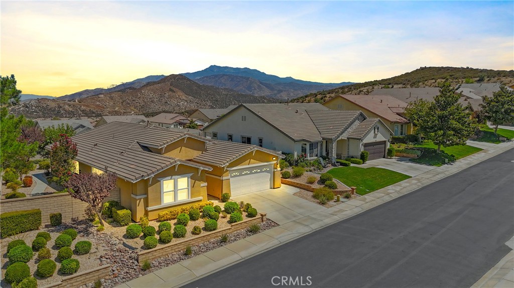FABULOUS VIEWS - MOUNTAIN & CITY LIGHTS from this Beautiful Laurel II with PAID OFF SOLAR (2200 Sq Ft - 2 Br + Office + 2 BA SINGLE LEVEL) located on an Awesome Corner, Low Maintenance VIEW Lot. Some of the Features include: Upscale Large Tile Flooring & Carpets in Bedrooms; Whole House Water Purifier; Country Kitchen with Granite Counters, Island & Breakfast Bar Looking Out to Great Room, Eating Area in Kitchen & Butlers Pantry, and Newer Dark Tone Stainless Steel appliances (Double Oven) - All Appliances are Included; Custom fans & Lights; DEN/Office with Tasteful Built-in Cabinetry; Laundry Room with Storage Washer (brand new) and Dryer included in price; Epoxy Flooring in Garage and 220 AMP for Electric Cars. The Fully Fenced PRIVATE VIEW Yard is a dream care-wise (EASY) with Lemon & Lime Trees and attractive Drought Resistant Landscape. Add on EXCEPTIONALLY LOW MELLO ROOS - This one won't last...... FOUR SEASONS goes beyond just a place to live - It's a vibrant community designed to keep you Active & Engaged, offering: THREE Club Houses; A Restaurant; Beauty Salon; Massage Parlor and Facial Salon; THREE Swimming Pools & Spa Areas with one Indoor Heated Pool; Movie Theatre; Billiards, 3 FITNESS CENTERS with state-of-the-art equipment, BBQ & Picnic Areas, Tennis Courts; PICKLE BALL COURTS, Paddle Tennis, Shuffleboard, Horseshoe and Putting Green, 6+ MILES of Nature/Hiking Trails; DOG PARK, and So Many Wonderful Activities & Clubs to meet new Friends and be as Active as you choose. FOUR SEASONS is approximately 30 miles from Palm Springs, at a higher elevation for a cooler climate to experience all of the four Seasons; Close to Shopping Centers, (including the World Famous Cabazon Outlet) Restaurants & Casinos, MEDICAL CENTERS/FACILITIES (Literally across the street from Loma Linda & Beaver Medical) - This Picturesque Community is surrounded by rich ranch lands with a Scenic backdrop of 2 Mountain ranges.