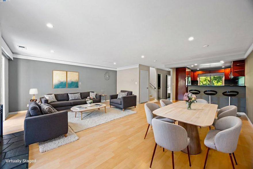 Welcome to your beautifully updated 3-bedroom townhome on Bay Farm Island!  Tucked away in the highly sought-after Islandia community, this home offers the perfect blend of comfort, convenience, and coastal charm. Step out your front door and into a lush greenbelt surrounded by mature trees—just steps from the sparkling community pool and a spacious clubhouse ideal for gatherings and celebrations.  Inside, enjoy a bright and open floor plan featuring gleaming hardwood floors, a modern updated kitchen, cozy fireplace, in-unit laundry, and even your own private sauna. The main living areas boast elegant hardwood, while the upstairs bedrooms are finished with brand new plush carpeting for a cozy and fresh feel.  The fully finished two-car garage includes ample built-in cabinetry for all your storage needs. Love the outdoors? The scenic Bay Trail is just around the corner, perfect for morning jogs or peaceful sunset strolls.  Top-rated schools, charming local cafes, shopping, and convenient access to the SF Ferry, Transbay buses, BART, and Oakland Airport make this an unbeatable location.