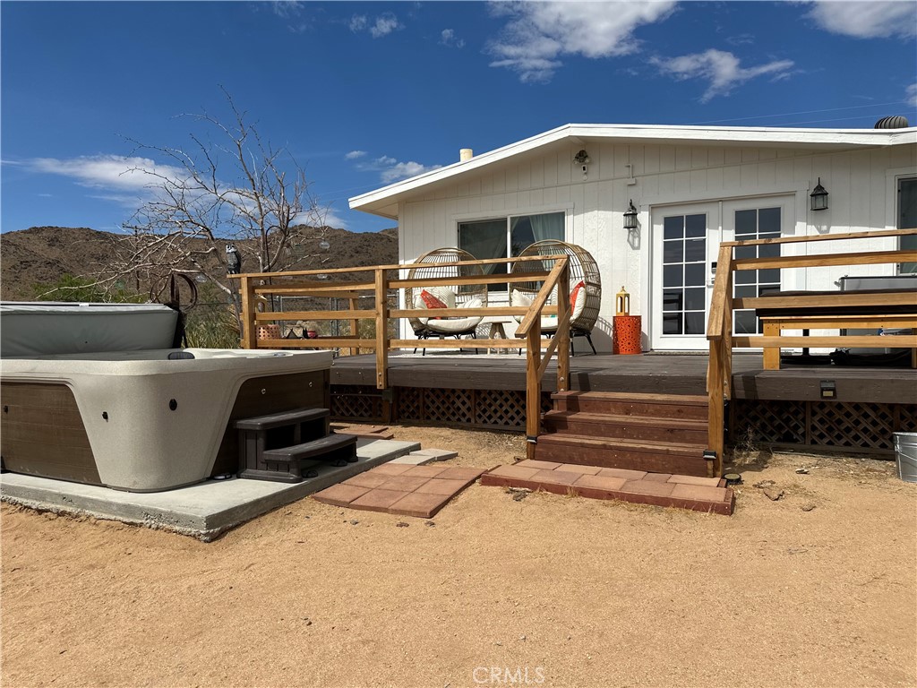 Escape to this tranquil desert retreat in Landers! Nestled on 2.5 acres, this inviting 2-bedroom, 1-bathroom home offers a perfect blend of modern comfort and desert charm. Whether you’re seeking a full-time residence, a weekend escape, or a short-term rental, this property is an ideal choice.
Recent updates include kitchen cabinets, countertops, and new flooring that add a contemporary touch. Mini-split systems provide year-round comfort, keeping the home cool during warm desert days and cozy on cooler nights. The property also features a newer septic tank for added peace of mind.
The exterior of the home boasts a private, fenced backyard designed for relaxation and entertainment. Unwind by the fire pit or enjoy stunning sunsets from the covered front patio. There’s also a relaxing spa and two cowboy tubs for the ultimate desert experience. The property includes a 45' container with its own mini-split and two sheds, offering ample storage and flexibility. An EV charger is available for electric vehicle owners.
Located just minutes from Joshua Tree National Park, Pioneer Town, and local attractions like the Integratron, this desert retreat offers a peaceful escape with convenient access to some of the area’s best spots. Don’t miss the opportunity to see this beautiful property—schedule a tour today!!