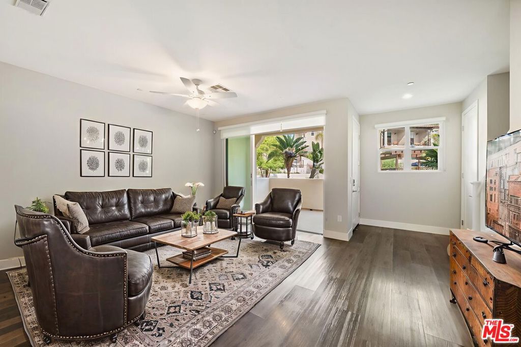 Welcome home to the 'Addison' floor plan, a beautiful tri- level luxury townhome. This stunning property boasts 3 bedrooms, 2.5-bath, indoor laundry room, attached garage and a generous bonus/ flex room. 4412 Paxton Place offers the perfect blend of comfort, style, and convenience across three well designed levels. With beautiful hill and pool views, additional features include THREE bedrooms on the top level. The primary bedroom features a bright bathroom with dual sinks, soaking tub with a separate full shower and an attached private balcony with views. On the main floor, enjoy the contemporary kitchen, equipped with an island, walk in pantry, beautiful pendant lights, stainless steel refrigerator, quartz countertops, oversized six burner gas stove top and oven. Also on the main floor, an open dining area and family room that includes 8 foot high sliding glass doors which open fully to access wonderful fresh air on the patio. Step to the bottom level and you will find the full size laundry room, that features a smart washer and full size dryer and bonus/flex space with direct access to the attached THREE car garage. The garage offers a 220 volt charger. Cool off in the community pool, work out in the gym and relax in the clubhouse. Centrally located with close proximity to Malibu, Calabasas Commons, Westlake Promenade, less than an hour to Los Angeles, dining options, market, parks, top rated schools and Pepperdine University. * photographs with furniture are virtually staged * photographs provided are of a similar unit with a similar floor plan. MOVE IN INCENTIVE OFFERED - CONTACT AGENT* Additional incentive - $6695 concession towards rent for 12 month plus lease *