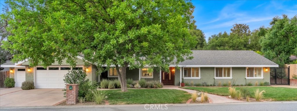 Welcome to your future sanctuary at 15833 Warm Springs Drive, located in the beautiful Woodlands of Sand Canyon. Majestic oak trees grace the neighborhood, offering shade and character that elevate the community's natural beauty and charm.
This sprawling single-story home has been tastefully remodeled, offering a harmonious blend of comfort and style across its spacious 2,691 square feet. As you enter, you'll be greeted by the warmth of the stone fireplace and the view of the backyard from the sliding doors that line the living room. The formal dining room is perfect for hosting dinners or intimate gatherings. The kitchen is a chef's delight, equipped with sleek Thermador appliances that elevate your culinary experience. Two-toned cabinets, subway tile backsplash and black leathered granite beautifully contrast the butcher block island with breakfast bar. A flex-space off of the kitchen is perfect for a walk-in pantry or wine room.
This 4-bedroom, 3-bathroom main residence presents an ideal layout, with one bedroom and a freshly remodeled bathroom on one side of the home with the remaining three bedrooms conveniently located down the hallway off the living room. The primary suite is a peaceful retreat with access to a patio. Each bathroom is designed with modern elegance and functionality in mind. There is an additional room currently used as a workout room that could be an office, den, or fifth bedroom.
Set on a generous lot, this property offers plenty of space. Enjoy the covered patio or the pizza oven while entertaining. The stunning pool and spa with baja step will have you feeling like you are on vacation in your own backyard. The garden area and serene koi pond add a touch of tranquility to your everyday life. For those with a passion for equestrian activities or DIY projects, the barn features horse stalls currently transformed into a workshop. The guest house, complete with a kitchenette and bathroom, provides a private retreat for visitors or potential rental opportunities.
Additional features include RV parking and EV charging. Discover the best that Sand Canyon has to offer in this exceptional property, where every detail is tailored to enhance your lifestyle. Make this enchanting retreat your new home!