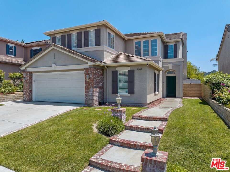 Welcome Home! This ultra-modern interior styled property within the established neighborhood of Stevenson Ranch offers an open floor plan, high-end black & white interior throughout the house gives clean, sleek, sophisticated vibe, with tons of natural light and warmth. Renovations completed in 2024, elegant hardwood flooring, new carpet with heavy padding for comfort and noise reduction, LED lights throughout the house, custom mini bar built-in with wine cooler and draft beer dispenser, all new kitchen appliances, double washer and double dryer, all counters throughout have the look of fine marble with durable ceramic material for easy usage and maintenance. House fan works to pull in air from outside to circulate inside air and cooking odors quickly. Custom audio system in the living room perfect for entertaining. The backyard has built-in bbq, with stunning mountain view for hours of enjoyment and relaxation.