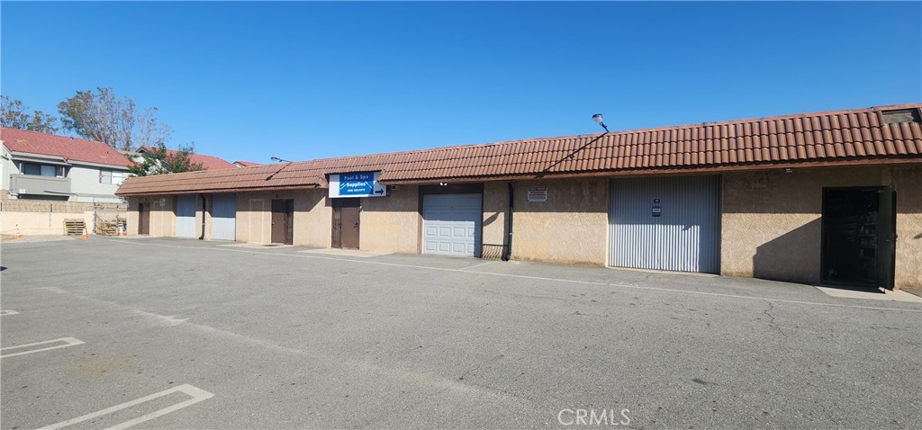 AS-IS Sale. Investment opportunity. Existing building sits on half acre lot featuring retail shop frontage and business office setup towards the back two units. Near Downtown Fontana. Conveniently located behind the Arrow Park Plaza shopping mall. Walking distance to public transit, other retail and restaurants. Building includes four individual units (A,B,C,D) complete with their own security door and garage entry. Paved parking lot provides ample parking space to accommodate customers and employees. Newly installed main electrical switchgear on exterior of building as well as other improvements inside.