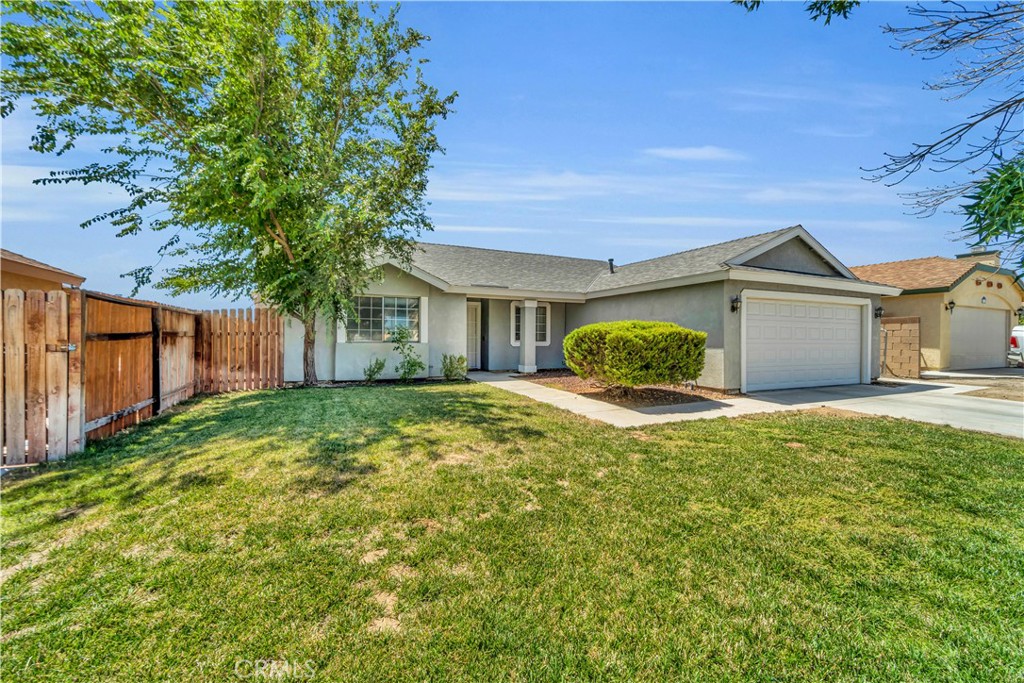 This charming home offers vaulted ceilings, a cozy wood-burning fireplace, and a thoughtfully designed layout with a dining area that separates the kitchen from the family space. Each room is delightfully styled, providing just the right amount of comfort and function for your family. Step outside to a spacious backyard-ideal for kids, pets, summer BBQs, and watching the sunset. Recent upgrades include a new roof, new AC with new ducting, and a new water heater. Plus, enjoy energy savings with Edison-supported solar. This is a true gem for your next chapter!