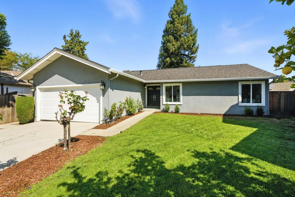 This 3BD/2BA residence offers a harmonious balance of comfort and modern living. Step into the inviting living room, where a brick fireplace stands at the corner. This cozy space is ideal for quiet evenings or social gatherings. To the left, the dining area and kitchen open seamlessly. The kitchen is filled with light, its sliding glass doors leading directly to a wooden deck. From here, the view opens to an expansive backyard, a versatile outdoor retreat. The private quarters of the residence are tucked away on the opposite side. The main bedroom is filled with natural light and features generous closet space, offering a serene environment for rest. Its ensuite bathroom is appointed with double sinks and contemporary finishes. Two additional bedrooms provide flexibility. A well-placed guest bathroom ensures ease and convenience. Every detail of this residence contributes to a sense of comfort and functionality, ready to be enjoyed in one of San Jose's welcoming neighborhoods.