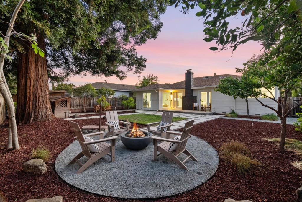 An unmatched blend of luxury, low-density neighborhood, and walkability, this stunning home was professionally designed and completely remodeled with permits by a licensed General Contractor and is located in one of the most desirable neighborhoods in all of Sunnyvale, thanks to its unusually wide streets, uncommonly large lots, and immediately recognizable pride of ownership, all just a leisurely walk to the downtown Heritage district and its array of elite dining, grocery, entertainment, and leisure. Meticulously remodeled throughout including an entirely new chef's kitchen with high-end solid wood modern cabinetry, quartz, new Bosch appliances, an eat-in island; two professionally designed and fully-rebuilt bathrooms with numerous high-end finishes including in-wall toilets, floor to ceiling tilework, and wall-mounted faucets; new wide-plank hardwood floors; new dual-pane windows; LED lighting; upgraded plumbing and electrical. Meticulous both inside and out, the sprawling floor plan flows seamlessly into a private backyard through dual Andersen doors & a new slider. Move-in ready and professionally dialed, this mid-century home and scenic neighborhood exude a combination of pride of ownership, walkability/commutability, and low-density living rarely found in Silicon Valley.