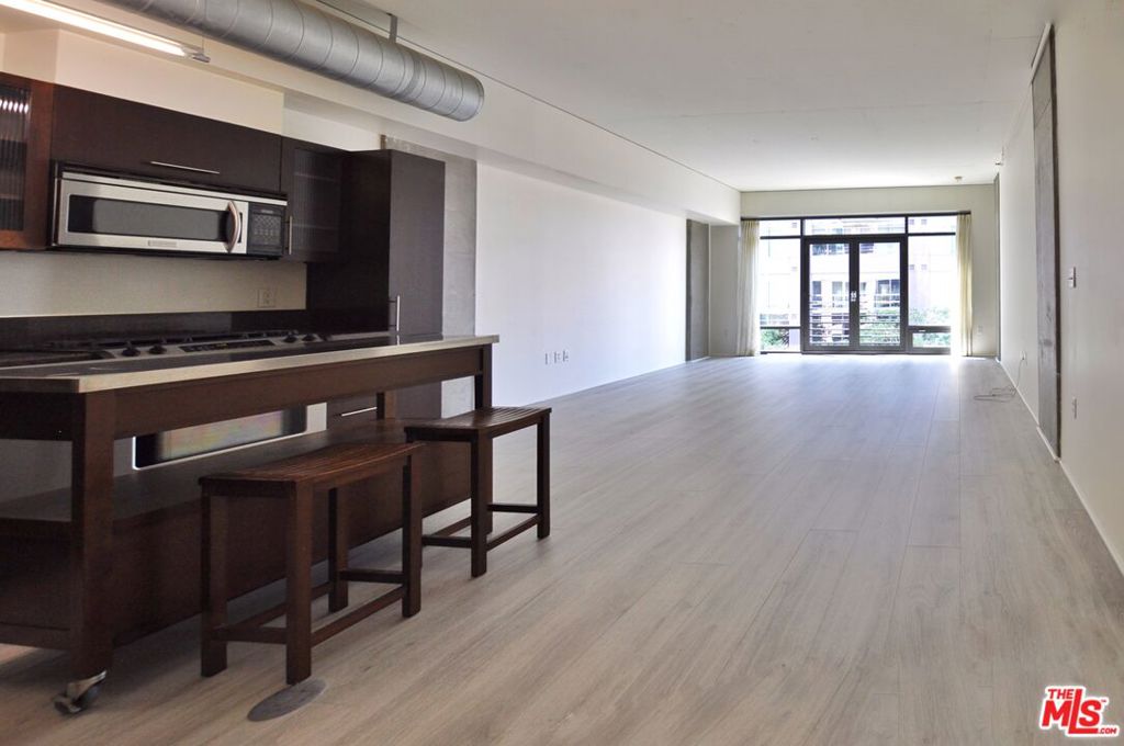 Spacious loft-style condo at the luxury LEED-Certified Elleven Building in the heart of the Social District. At 1100sf, this loft is one of the largest 1 bed/1 bath floorplans. This 9th floor loft features floor-to ceiling double pane windows with views of the DTLA skyline to the right, city lights to the left, and beautifully landscaped amenity deck below. A Juliet balcony via French doors brings in amazing breezes. The open plan kitchen features wood cabinetry, granite countertops, stainless steel appliances and movable island. The open bedroom area can be easily separated with a partition, shelving, curtain, etc, and has a large wall-to-wall closet. There is a spacious bathroom and generous sized laundry room with full size W/D that offers plenty of additional storage. Tall ceilings, newer engineered wood floors, central heat/AC operated with Nest Thermostat, and 1 deeded underground parking space complete this fantastic city loft. The Elleven building amenities include 24/7 reception desk and security, onsite manager M-F, beautifully designed lobby and patio sitting area, elevated deck with pool, hot tub, BBQ grills, landscaped garden and outdoor dining areas. Within blocks to the best of DTLA, including L.A. Live, Whole Foods, The Bloc, FIDM Park, Fig & 7th, The Broad, Walt Disney Concert Hall, South Park Commons, The Conrad, Proper Hotel, Wilshire Grand Center, Ritz Carlton, tons of dining spots, shopping and more.