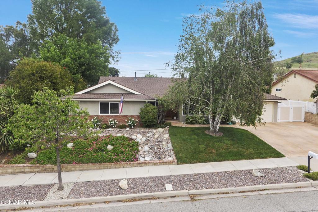 Beautiful single story home with lovely curb appeal. This home offers a spacious floorplan with a permitted enclosed patio of approx. 416 SF and 1804 SF house for a total of 2220 SF. Welcoming living room with fireplace offers a cozy atomosphere. Remodeled kitchen with Quartz counters, stainless steel appliances, subway tiles, cabinetry replaced, faucet fixtures replaced. Enjoy gathering and entertaining in large dining room that opens to extra large enclosed patio. The enclosed patio has an expansive wall of windows that overlooks the backyard and it would make a great billard or game room. Primary bedroom suite has sliding doors that open to patio sitting area. Three spacious secondary bedrooms. Relax and entertain in the nicely landscaped low maintence backyard with built-in BBQ, firepit, a horseshoe pit and outdoor lighting adding nightime ambiance. Lots of room for patio tables and chairs. There is side yard parking for a low profile boat or trailer. Updates include remodeled kitchen, lovely laminate flooring, new carpet in all bedrooms, dual paned windows, skylight installed, roof replaced, HVAC replaced, new water heater, main sewer line to street replaced, landscape redone, automatic sprinkers/drip system on timers, stamped concrete driveway. Conveniently located in the heart of Thousand Oaks with nearby shopping, dining entertainment and award winning schools.
