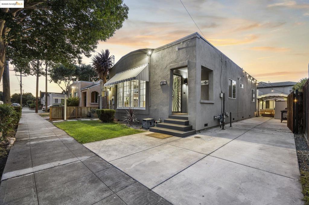 Welcome to this extensively renovated property featuring a beautifully upgraded 2-bedroom, 1-bath smart home, plus a permitted, fully detached 1-bedroom, 1-bath ADU, each with its own street address. The main residence offers a bright, open-concept floor plan with a modern kitchen equipped with Taj Mahal quartzite countertops, smart stainless steel appliances, pot filler, and high-end finishes. Additional upgrades include bamboo hardwood flooring, double-pane windows, Tankless water heater, smart lighting with phone/voice activation, and an EV charging station. The bathroom features a wall-mounted electric towel warmer and a framed LED medicine cabinet mirror for a luxurious spa-like touch. The detached ADU provides complete independence with a private entry, full kitchen, in-unit washer and dryer, ideal for multigenerational living, rental income, or guest accommodations. The low-maintenance backyard is designed for entertaining, with an outdoor kitchen, 65-inch television, ambient lighting, and a mature avocado tree. Conveniently located near downtown San Leandro, shopping, dining, BART, and major commute routes.