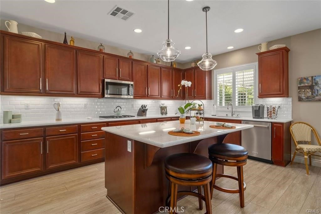 Hot Lease Listing. *** This is an Unfurnished property.*** This Beautiful Mediterranean Home in the highly sought-after community of Morgan Hill, with incredible curb appeal is now available for lease for the first time. An amazing floorplan and a Beautiful Corner lot location! This desirable home is loaded with high end finishes and includes a gorgeous greenbelt VIEW offering complete privacy, 4 Bedrooms, 3 baths and an Open Concept that doesn't become available often! Leading to the front door you will be greeted with a cozy front porch and beautiful professional hardscape/landscape. As you enter the main residence the foyer opens to a flex space room that is currently being used as a den but could be an office or a 4th bedroom. Adjacent to the Flex space is a full bath complete with walk in shower. Beautiful wood LVP neutral flooring leads you past the staircase to the open concept kitchen/family room area. A chef's dream. .. the kitchen features rich wood cabinets, white subway tile backsplash, upgraded stainless KitchenAid appliance package, large center island, beautiful quartz counter tops and custom pendant lighting. The large Family room features a cozy fireplace with beautiful custom-built in. Upstairs you'll find 3 additional bedrooms including a large primary suite and beautiful spa like primary bath, complete with makeup vanity, large soaking tub and large walk-in shower. The 2 upstairs guest bedrooms are roomy and feature ample storage. A large hall bath, upstairs laundry and custom built-in work space complete the second floor! The backyard is your own private oasis featuring an attached patio cover, a built-in barbecue island, a tranquil waterfall feature, fire-pit and a separate pergola area perfect for entertaining!! Last but certainly not least, a private and beautiful greenbelt VIEW! Enjoy sunsets and watching hot air balloons rise over Wine Country! No expense has been spared on this gorgeous home . .. the list of upgrades is long, surround sound, plantation shutters, built in closet systems, built in shelving and workbench at garage, New carpet and LVP have recently been added, whole house fan, new garage door and opener, custom storage shed on the side yard and so much more! ALL this and Morgan Hill Community Amenities pool/spa/clubhouse/tennis courts and more!