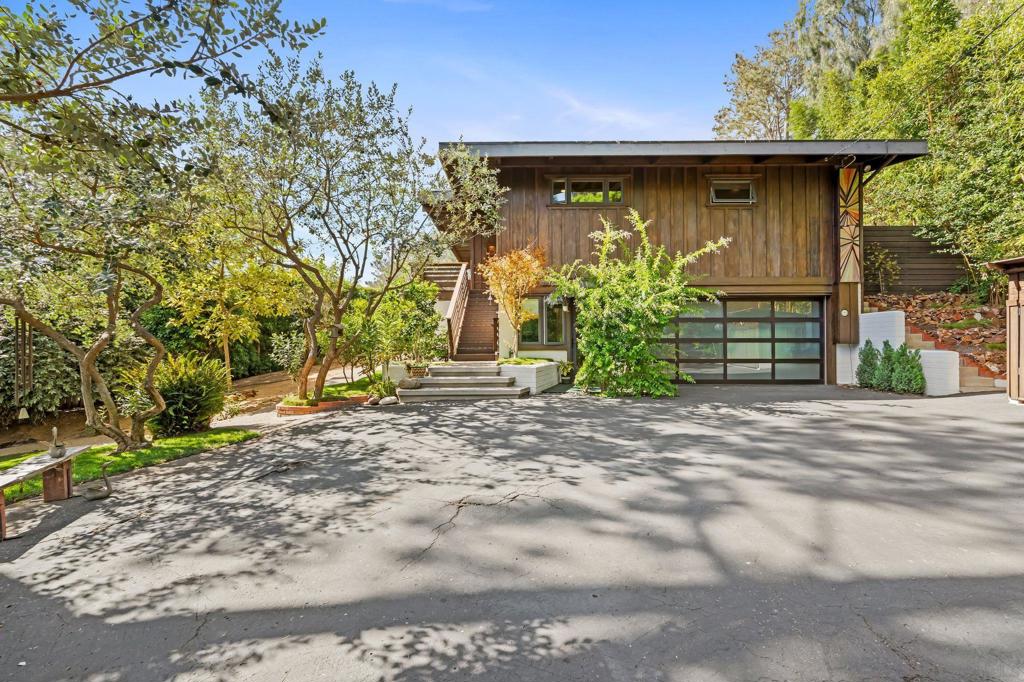 Perched on one of Del Mar’s most sought-after streets, this exceptional property offers sweeping ocean views, unmatched privacy, and an oversized lot of more than one-third acre, an incredibly rare find in Del Mar! Surrounded by mature trees and lush landscaping, the setting feels like a private coastal retreat while still just moments from the beach and village. Walls of glass frame panoramic views of the Pacific and iconic Torrey Pines, filling the home with natural light and a seamless indoor-outdoor flow. The timeless mid-century modern design features exposed wood-beam ceilings, a spacious great room, and an entry-level primary suite. Thoughtful upgrades include air conditioning, smart home automation, and high-quality finishes that enhance comfort while preserving the home’s character. The outdoor spaces are designed for relaxation and entertaining, with expansive custom decking, a forever pool, built-in spa, and outdoor shower, all oriented toward dramatic sunsets over the ocean. With its oversized lot, rare privacy, and breathtaking views, this residence embodies the very best of the Del Mar lifestyle!
