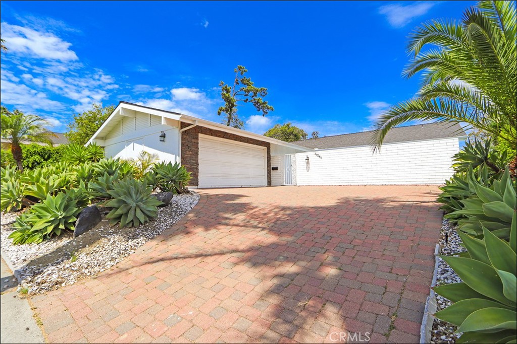 PANORAMIC CITY-LIGHTS AND HILLS VIEWS FROM THIS SPACIOUS SINGLE LEVEL HOME IN LAGUNA NIGUEL! Updated, bright, and easy to love, this sprawling single level detached residence offering three bedrooms, two bathrooms offering high ceilings, an open living/dining area, and a spacious kitchen which has been remodeled with upgraded cabinets, stone countertops, stainless steel appliances and exposed hood that opens to an expansive deck and outdoor living space. Remodeled bathrooms with upgraded walk-in shower, frameless glass enclosure, upgraded vanities and fixtures. Upgraded flooring and baseboards, added and upgraded recessed lighting and so much more. A private gated courtyard welcomes you at the entry, while a two-car attached garage with large circular driveway and low-maintenance grounds add everyday convenience. Just minutes to Salt Creek Beach, the Ritz-Carlton/Waldorf Astoria, Laguna Niguel Regional Park, trails, and local shops—everything coastal OC at your fingertips. Quiet street, refreshing breezes, and a thoughtfully designed layout for both comfort and entertaining.