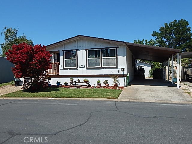 SENIORS - COME TAKE A LOOK at this listing in Woodson Bridge Estates - This home sports a new front porch - new laundry room floor - new front siding/skirting - you must come take a look! This home also sports 2 bedrooms, 2 baths and has 1,344 square feet of living area. Plus a BONUS - an enclosed attached porch area, approximately 8' X 28', for extra storage/office space or just a nice sitting room-make it your own space! Additionally, come see the open floor plan with vaulted ceiling - open kitchen area and dining area, move into the living room with a mini bar and pellet stove. The Master Bath has a walk in shower along with a nice sunken bath tub. A must see! Woodson Bridge Estates is one of the nicest Senior Parks in Tehama County. Of course there is a Club House where many events take place such as Friday evening potlucks - billiards - card games - bingo - and special Holiday get togethers and much more. There is a Swimming Pool to enjoy during the hot summer months and a Jacuzzi. Buyers must be approved by Park Manager to rent in the park. Pets are welcome, but are limited - check with Park Manager for details. Woodson Bridge Estates is located on the high side of the Sacramento River - according to many reports it is not located in a flood zone. Come enjoy leisurely early morning walks around the park or along the Sacramento River - easy living for sure! Check it out! Don't miss out on this one!!!!!!