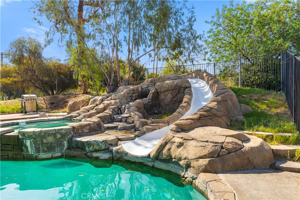 A Rare Find: Incredible Views, Private In-Law Suite, Heated Pool, & Seller-Paid Solars!
This private gated one-floor residence is nestled in a beautiful area, offering breathtaking views of the valley, mountains, and city lights. The spacious open floor plan is perfect for comfortable living, and the home includes a versatile in-law suite (ADU) with a wood-burning furnace and kitchenette—ideal for family, renters, or whatever suits your needs. Situated on just over one acre, this property offers plenty of space, including room for horses or gardening, making it a true rural escape with modern comforts. The property features a heated pool, perfect for year-round enjoyment, as well as a jacuzzi (spa) for ultimate relaxation while you take in the stunning views. Whether you're looking to unwind or entertain, these luxurious amenities are ideal for both. Property is equipped with two sets of solar panels (Tesla and Sunnova), making it energy-efficient and cost-effective. NO HOA!! This property is a rare find—whether you're looking for a family home, a rental opportunity, or a tranquil retreat, it has it all. AMAZING VIEWS. Don’t miss out on the chance to make it yours!