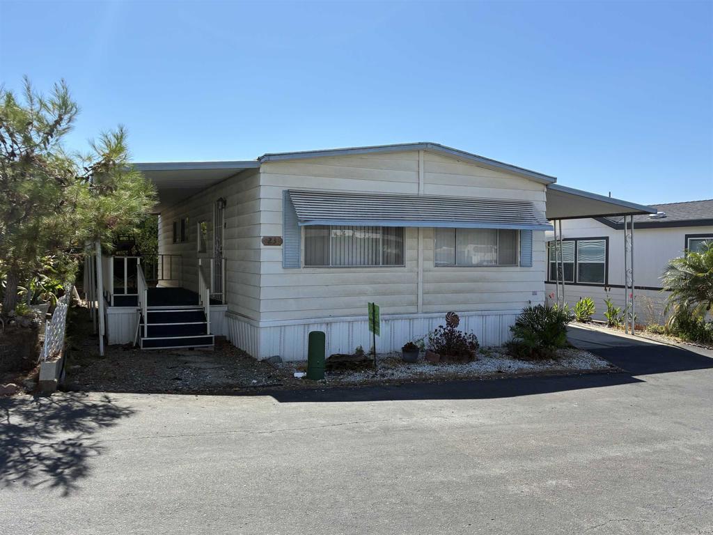Located in a 55+ community that is walking distance to Stater Brothers grocery store, Walgreens (Rx), Walmart (Rx), Target (Rx), dining, animal veterinarian, and more! Also, convenient freeway access to highway 78! Home needs some TLC and has been priced as a fixer upper. 2 walk in closets. Large backyard, two storage sheds, covered porch and covered carport for up to two cars. Located in a 55+ community in which the second resident can be as young as age 30. Two pets are permitted with prior approval by the management (breed restrictions apply). This park offers many amenities including a clubhouse, pool, spa, billiards, library, guest parking and free food handouts every Wednesday! Monthly space rent is $1,450.