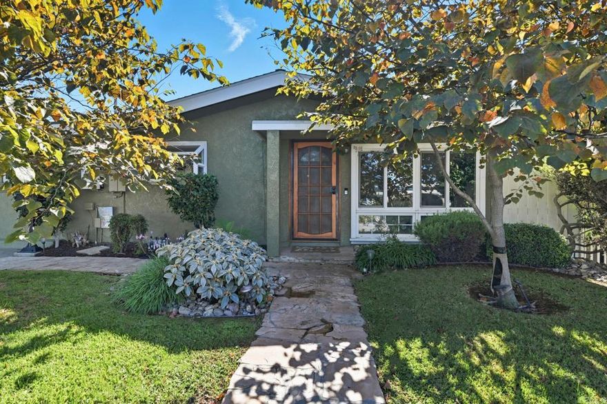 Welcome to 9261 Fullerton Avenue, a Craftsman-style single-story home blending timeless charm with thoughtful upgrades. Nestled in Serra Mesa, this reimagined 3-bedroom, 2-bath residence offers classic character, refined comfort, and a spacious backyard full of opportunity. Light-filled interiors feature original architectural touches and custom stained-glass details. Distressed hickory hardwood floors flow throughout, complemented by porcelain tile in remodeled baths. Vaulted bedroom ceilings, new skylights, and front-facing windows enhance the warm, inviting ambiance. The remodeled kitchen serves as the heart of the home — upgraded appliances and stylish finishes connect seamlessly to dining and living areas, perfect for daily living or entertaining. Both bathrooms have been updated, and the property includes an additional approximately 344 sq ft of flexible living space between the converted garage and sunroom, offering endless potential for a home office, studio, gym, or lounge bringing the total liveable Sq Footage to 1,644 sq ft. Energy-efficient upgrades include central heating, leased solar, a new electrical panel, and a new sewer line to the street. Step outside to redesigned front and back yards featuring new turf, drought-tolerant landscaping, and upgraded auto drip irrigation — approximately 6,000 sq ft ready for a covered patio or ADU. Located on a quiet street minutes from Snapdragon Stadium, parks, shopping, dining, and major freeways, this home offers central access with a peaceful neighborhood feel. Don’t miss this rare opportunity to own architectural character with modern upgrades and expanded living potential in the heart of San Diego!