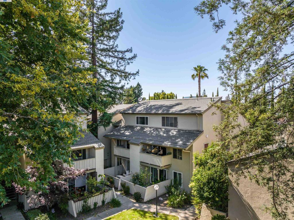 Welcome to easy East Bay living in this bright and inviting 3-bedroom, 2-bath condo located in the convenient Oak Road Station community of Walnut Creek. With 1,259 square feet of well-designed living space, this home offers comfort, style, and an unbeatable location. The main living area features an open layout with a cozy living room, dining area, and updated kitchen complete with granite countertops, full tile backsplash, stainless steel appliances, and tile floors. Enjoy warm natural light, plantation shutters, and durable laminate flooring throughout—no carpet means low maintenance and room to style as you wish. Step out onto your private balcony to enjoy the breeze or unwind after a long day. The spacious primary suite includes a walk-in closet and a beautiful ensuite bath with granite countertops and eye-catching blue tile in the stall shower. Two additional bedrooms offer flexibility - plus easy accessibility to the secondary bathroom. Enjoy community amenities including a sparkling pool, greenbelt areas, and convenient laundry facilities. But the real standout? Location. This home sits right along the Contra Costa Canal Trail with Walden Park just next door. Walk to Bay Club Walnut Creek, or hop on BART just minutes away.