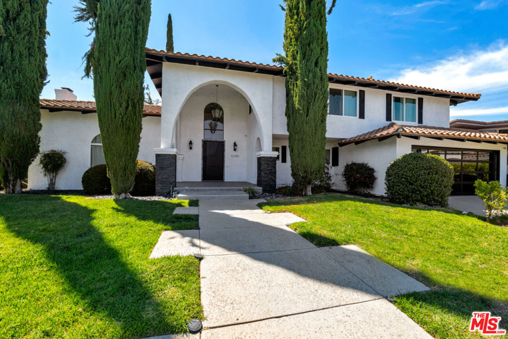Discover a rare opportunity to purchase or lease a fully remodeled luxury home in one of Westlake Village's most sought-after neighborhoods. Tucked away on a quiet cul-de-sac, this stunning corner-lot residence offers the perfect balance of comfort, elegance, and lifestyle flexibility.From the moment you step inside, you're welcomed by soulful design and warm sophistication. The home blends timeless character, such as adobe-style fireplaces, hardwood floors, artisan tile, and a wrought-iron staircase, with sleek modern upgrades including LED lighting, custom chandeliers, dual-pane windows, and natural stone finishes.The expansive layout features a formal living room, a cozy family room, and a chef's kitchen designed for both beauty and function. Highlights include stone countertops, Euro-style cabinetry, and high-end appliances: a stainless steel Hestan refrigerator/freezer, dishwasher, microwave, Forno range/oven, farmhouse sink, and a dedicated beverage center.Upstairs, the primary suite offers a luxurious private retreat, complete with a fireplace, dual closets, and a balcony with breathtaking views of the surrounding mountains and Westlake Lake. The ensuite bathroom is spa-inspired, featuring marble floors, a soaking tub, barn-door glass shower, and exquisite designer fixtures.Zoned for top-rated Las Virgenes schools and ideally located just minutes from The Promenade, Stonehaus, boutique shopping, fine dining, golf, and miles of scenic trails, this home offers far more than a place to live. It's an invitation to experience the elevated, effortless lifestyle of Westlake Village, whether you choose to own or lease. Available For Sale For $2,799,000.