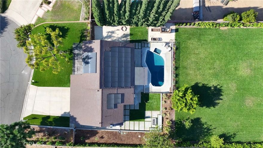 This stunning 4 bedroom, 3 bathroom Dual Master pool home is located on a completely flat half-acre lot at the end of a quiet cul-de-sac. Offering ample space for RV or boat parking, horses, and more. Upon entering the property, you'll be welcomed by vaulted ceilings, abundant natural light, and carefully curated designer finishes. The fully remodeled kitchen features custom oak cabinetry, a large island, stone backsplash, and high end stainless-steel appliances. The home offers two luxurious primary suites—one upstairs with a spa-like bathroom, walk-in closet, beverage center, and new washer and dryer. Another primary is downstairs with a floating double vanity and custom tiled shower. All bedrooms feature wide plank white oak flooring and generous closet space. Step into your resort-style backyard, complete with a newly plastered pool and spa, built-in gas fire pit, covered patio, BBQ island (now converted to natural gas), pool fence, and new wireless pool controller, lights, and pool sweep. The outdoor space has been extensively enhanced with stonework, landscape lighting, a new irrigation system with a smart sprinkler box and timer, new plants, tree removal, and borders around flower beds.

Upgrades continue throughout the home with a New Paid Off solar system, custom closets, attic fan, soft water system, solar shades, EV chargers, 

3 Tesla Powerwalls, and  insurance-grade water flow monitoring (Flo system). With a three-car garage, sparkling pool, and access to award-winning schools, this one-of-a-kind property offers the ultimate in comfort, style, and functionality. This is California living at its finest!