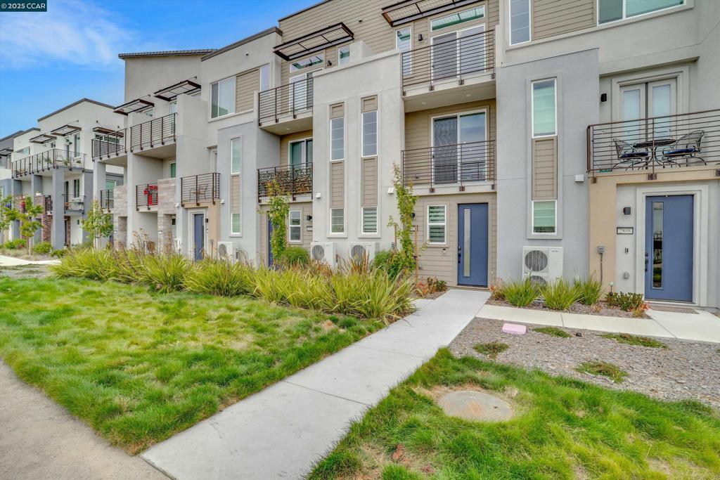 Live the Bayfront lifestyle in the heart of Alameda at Bay37—Alameda Landing’s vibrant Pulte community built in 2023. This modern 3-level townhome offers 2 bedrooms, 1.5 baths, and an open floor plan featuring a gourmet kitchen and spacious Great Room that opens onto a deck with open Bay Trail views, instead of facing neighbors. With 3 balconies and an east-west orientation, the home gets an abundance of natural light throughout the day. Includes owned solar, A/C, heating, Ring doorbell, and 1-car garage prewired for EV charging. Located along the Bay Trail with direct waterfront access, the community offers amenities incl. waterfront park, picnic areas, a playground, and a public dock. Located minutes from Target, Safeway, Chinatown, and multiple breweries. Short drive to South Shore Plaza, Park St, and Webster St. Easy access to BART, freeways, free water taxi to Jack London Square, and 3 Ferry terminals w/ service to DTSF.