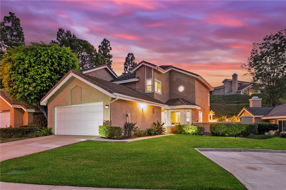 A wonderful home well situated at the end of a quiet cul-de-sac, within Horizons - a safe and peaceful community, high in the hills of Anaheim. Horizons is a beautifully maintained community surrounded by views, hiking trails and nature. One bedroom and full bath down stairs. Two ensuite bedrooms upstairs. Enter to the family room with high ceilings for that large open feel. The family room and dining area open to each other and nicely-flow to the spacious and private, low maintenance back-patio, perfect for your indoor/outdoor entertaining. Move-in ready. Community pool & guest parking. HOA covers roofs, exteriors front-yard landscaping, and more - no gardener needed with this home. Great schools. Close-by golf, parks, hiking trails, horse trails, Saddle Club, Nature Center, restaurants, shopping and entertainment. Quiet neighborhoods, beautiful hills and a constant breeze all provide that feeling of being away from it all while still being close to so much. A wonderful place to live!