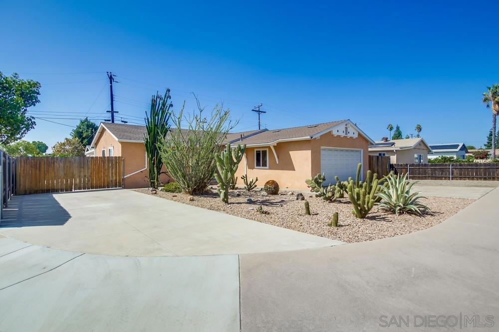 Charming home with lots of character! Situated on a large corner lot, this warm home feels bright & inviting. The kitchen features long counter tops, tons of storage, gas stove, new dishwasher. The large open living room lhas plenty of windows & natural light, and leads out to your private outdoor space. The patio has a newly built cover, multiple parking/storage spots, and a good sized utility storage shed. Located in the heart of El Cajon close to eateries, shopping, & more. Highways, hiking & mountains are minutes away.